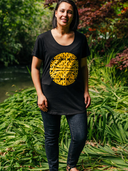 Māori Inspired Yellow Koru Design Tee in Black representing Mahina our Māori Moon story from our Māori Gods. Talking about the new moon new year new beginnings. Designed by Māori Fashion Designer Adrienne Whitewood.