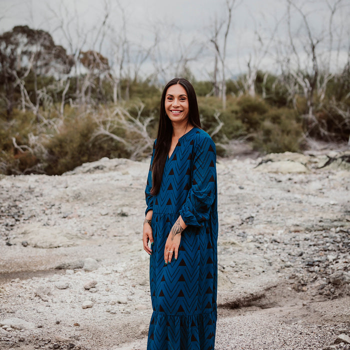 Māori Inspired Designed Print in Black on a Blue Dress by Māori Fashion Designer Adrienne Whitewood