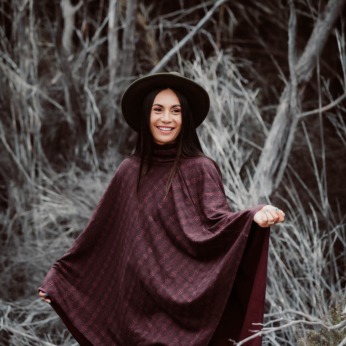 Maori Inspired Patere Design on Burgundy Organic Cotton Poncho by Aotearoa Fashion Designer Adrienne Whitewood