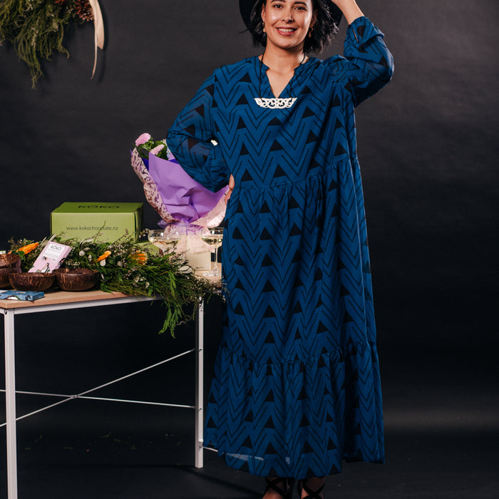 Māori Inspired Designed Print in Black on a Blue Long sleeve Dress by Māori Fashion Designer Adrienne Whitewood